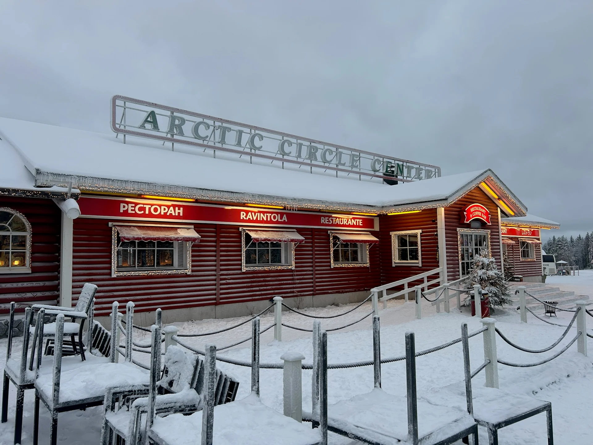 Snow-covered Arctic Circle Center restaurant at Santa Claus Village