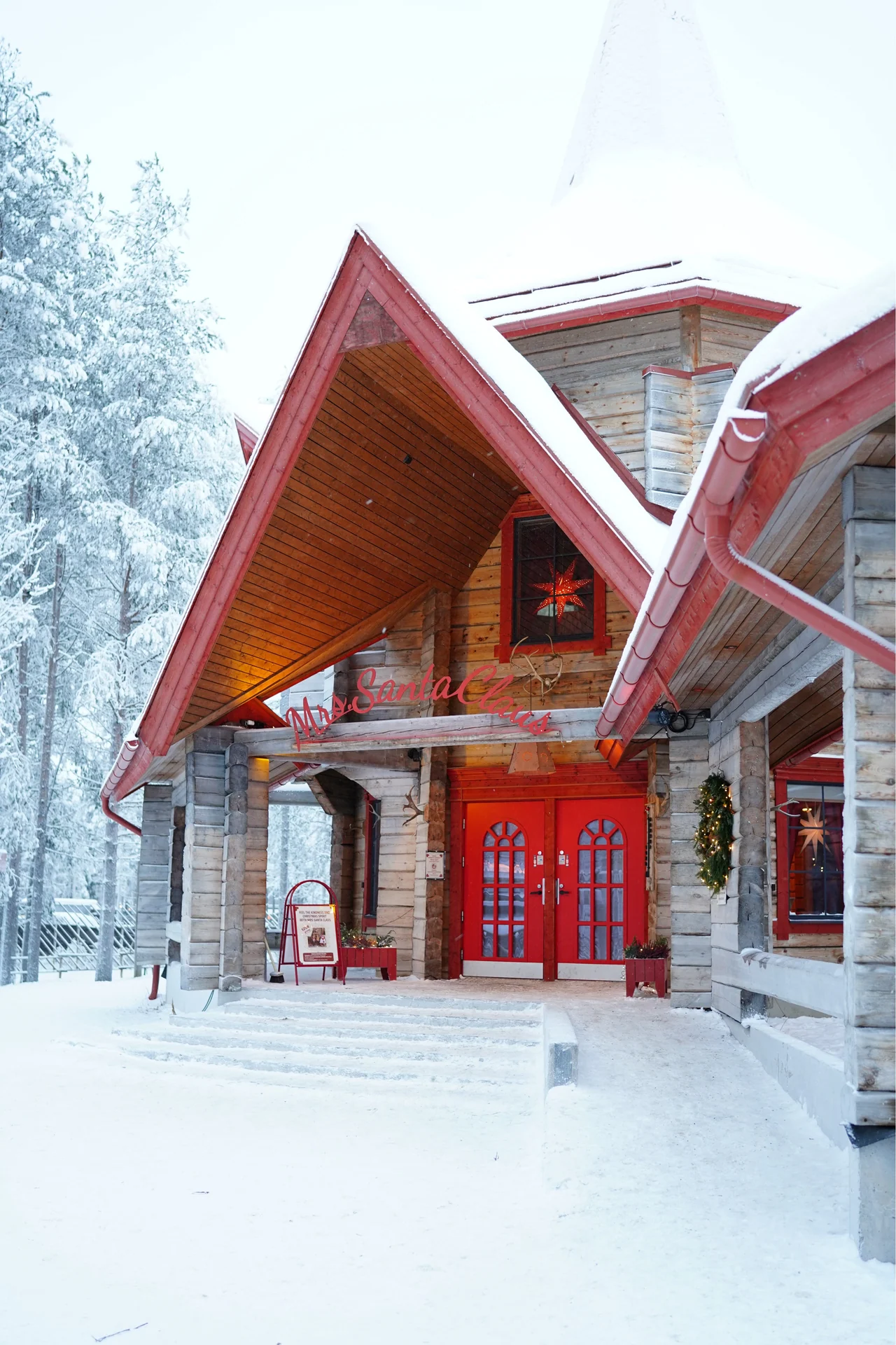 Snow-covered entrance to Mrs Santa Claus's cottage at Santa Claus Village